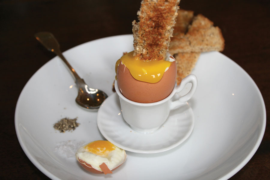 Boiled egg, yellow yolk, dipping toast